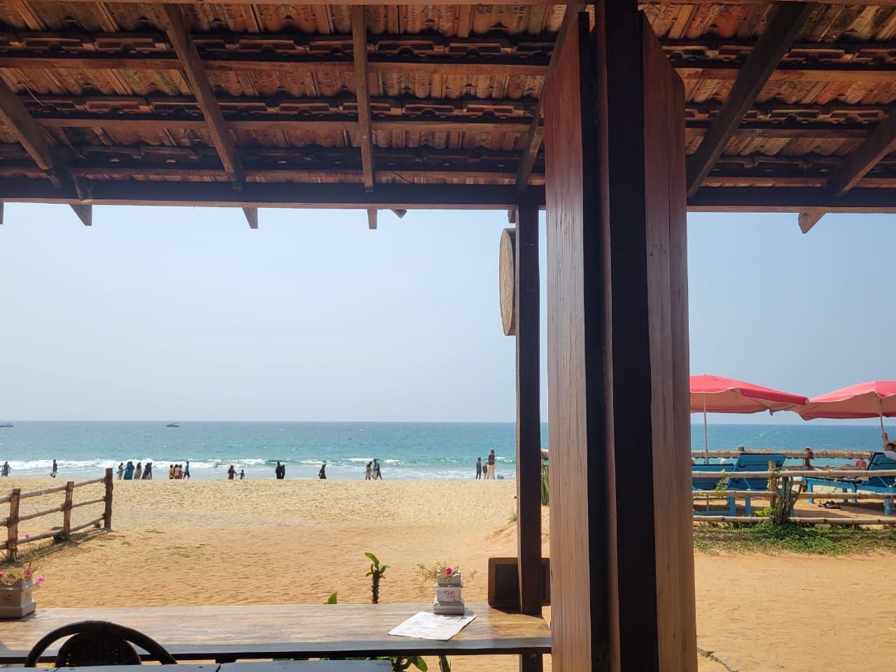 View of the beach from a wooden beachside café